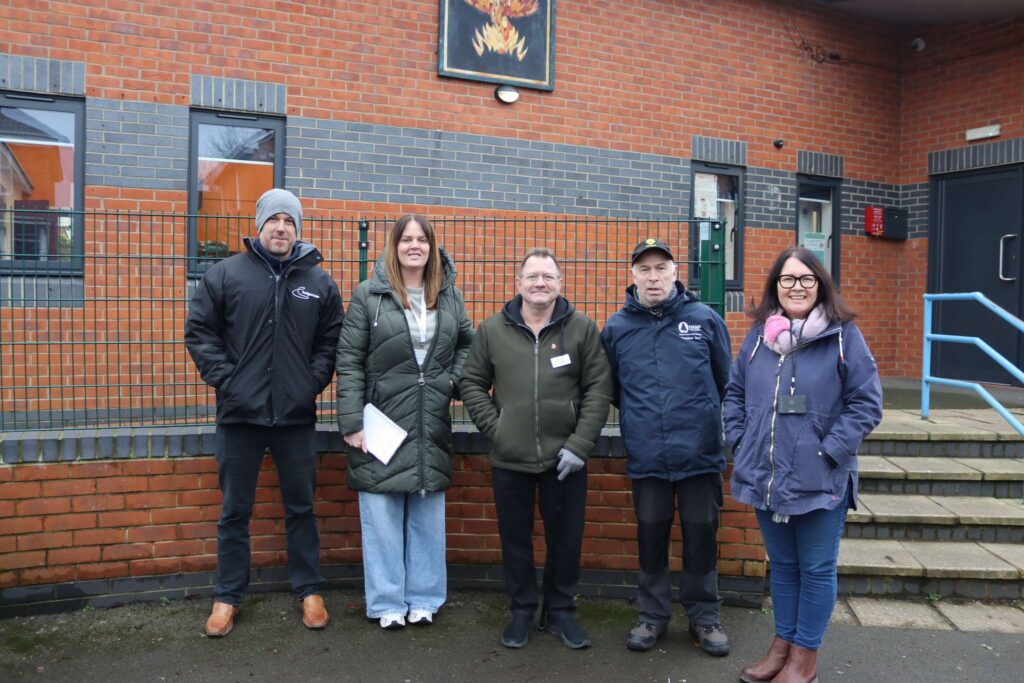 Homes in Somerset colleagues, Star of The Year Winner, Steve, and Involved Customer, Craig posing for a group picture on the Hamp Estate Walkabout in 2025.